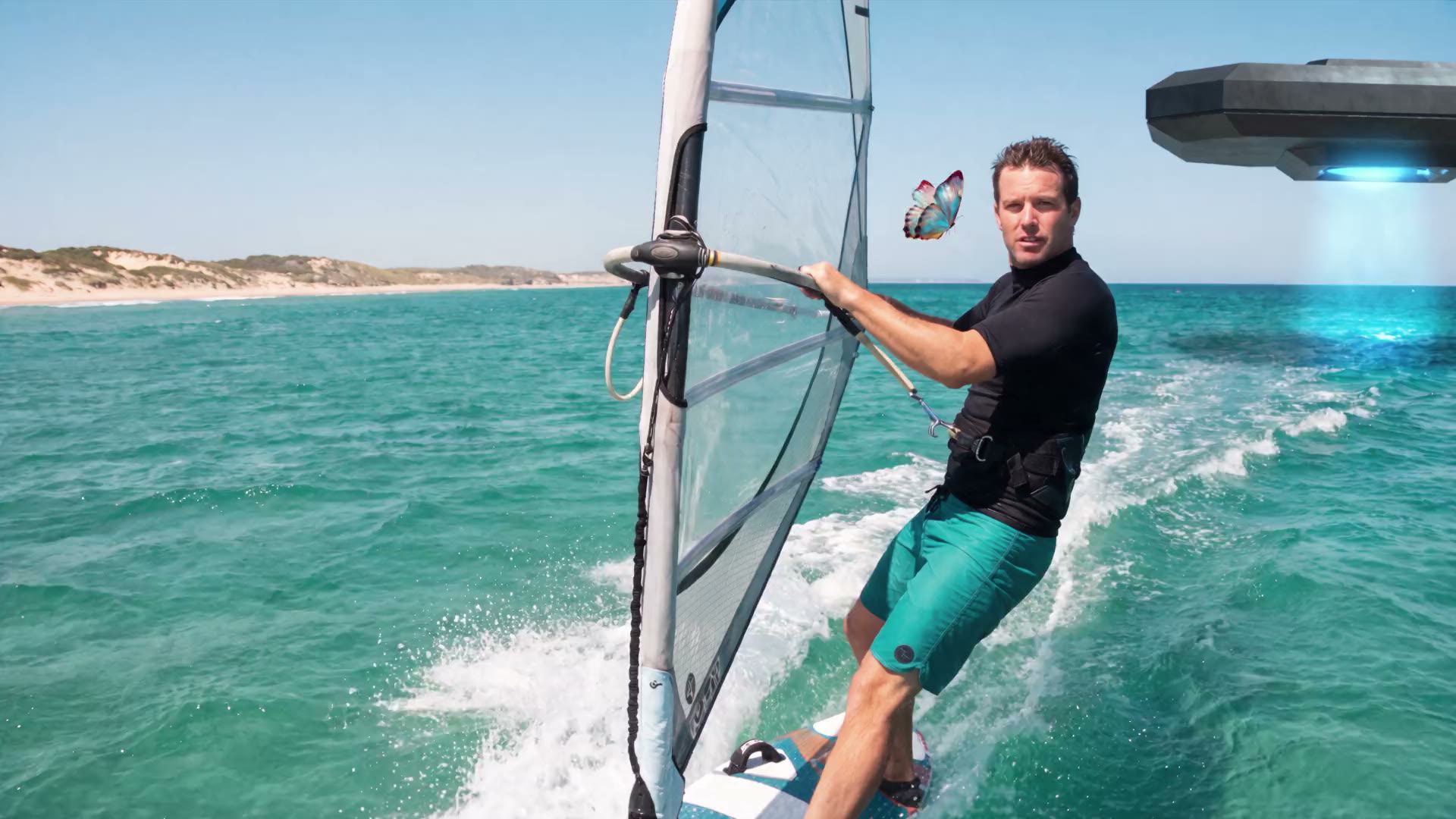 Scene 1 of a film made in ACT 3: a windsurfer races the coast beside a butterfly while an alien ship hovers over the water behind him