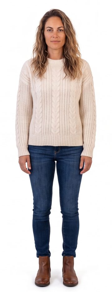 Sally in a cable-knit sweater and jeans
